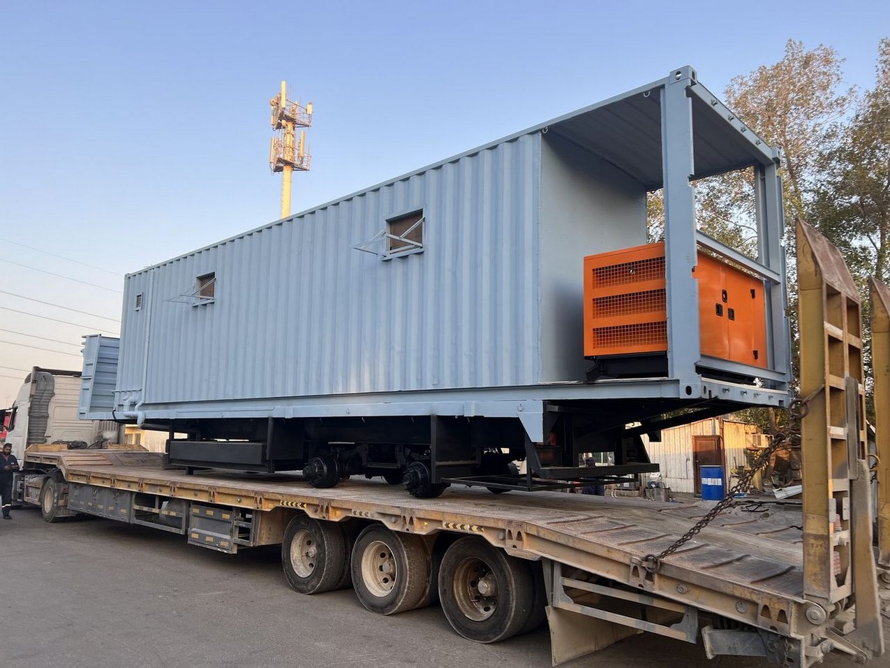 Blast-resistant module loaded on a truck, ready for mobilization